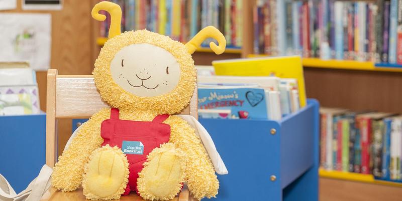 Bookbug soft toy in a library
